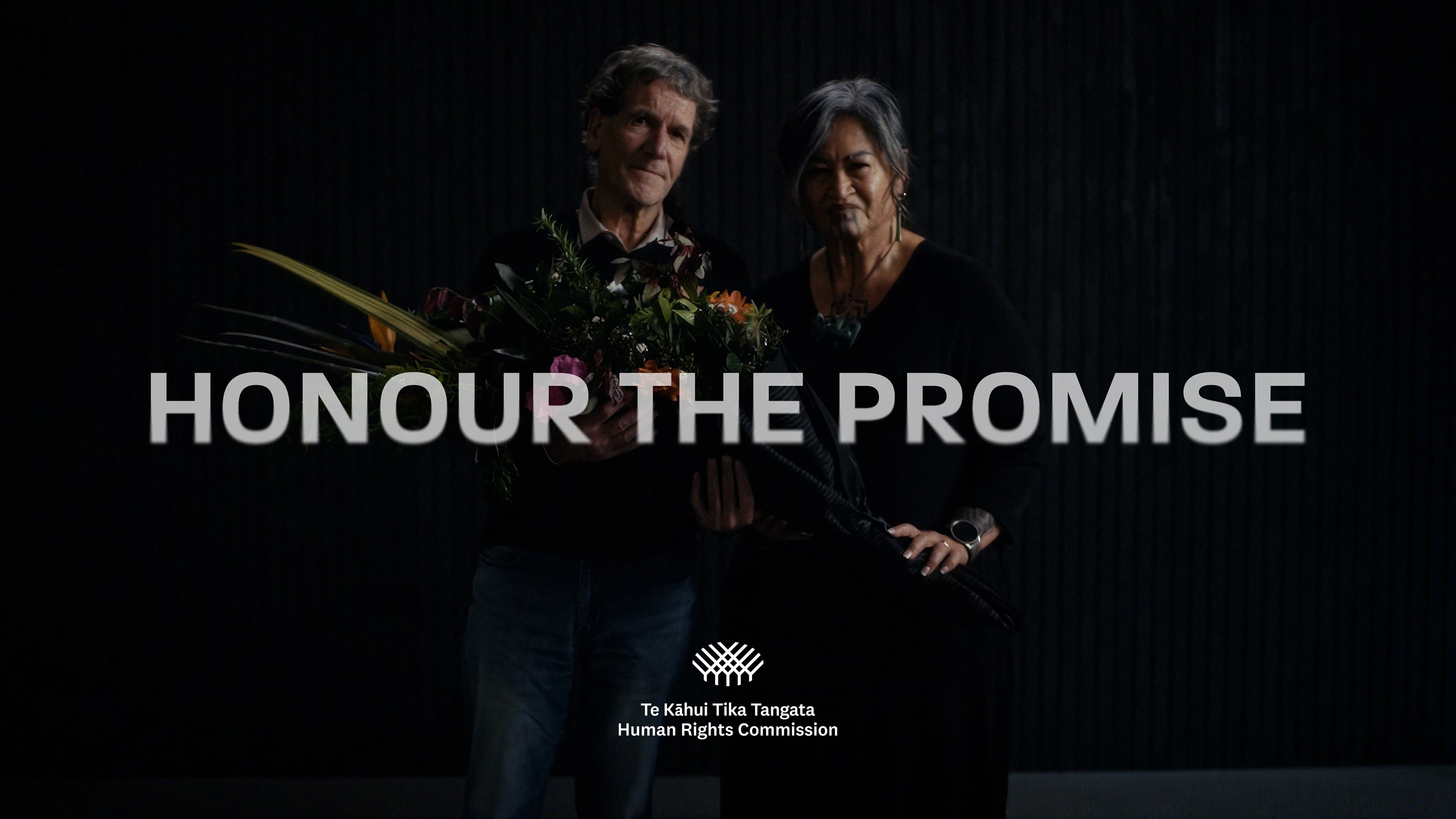 Honour The Promise with two survivors holding a bouquet of flowers 