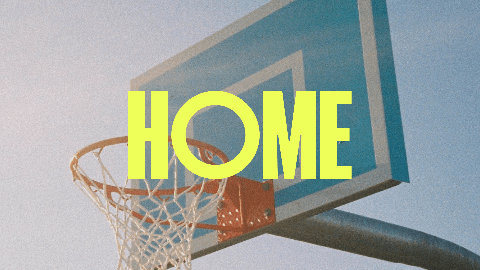 HOME logo in front of a basketball hoop