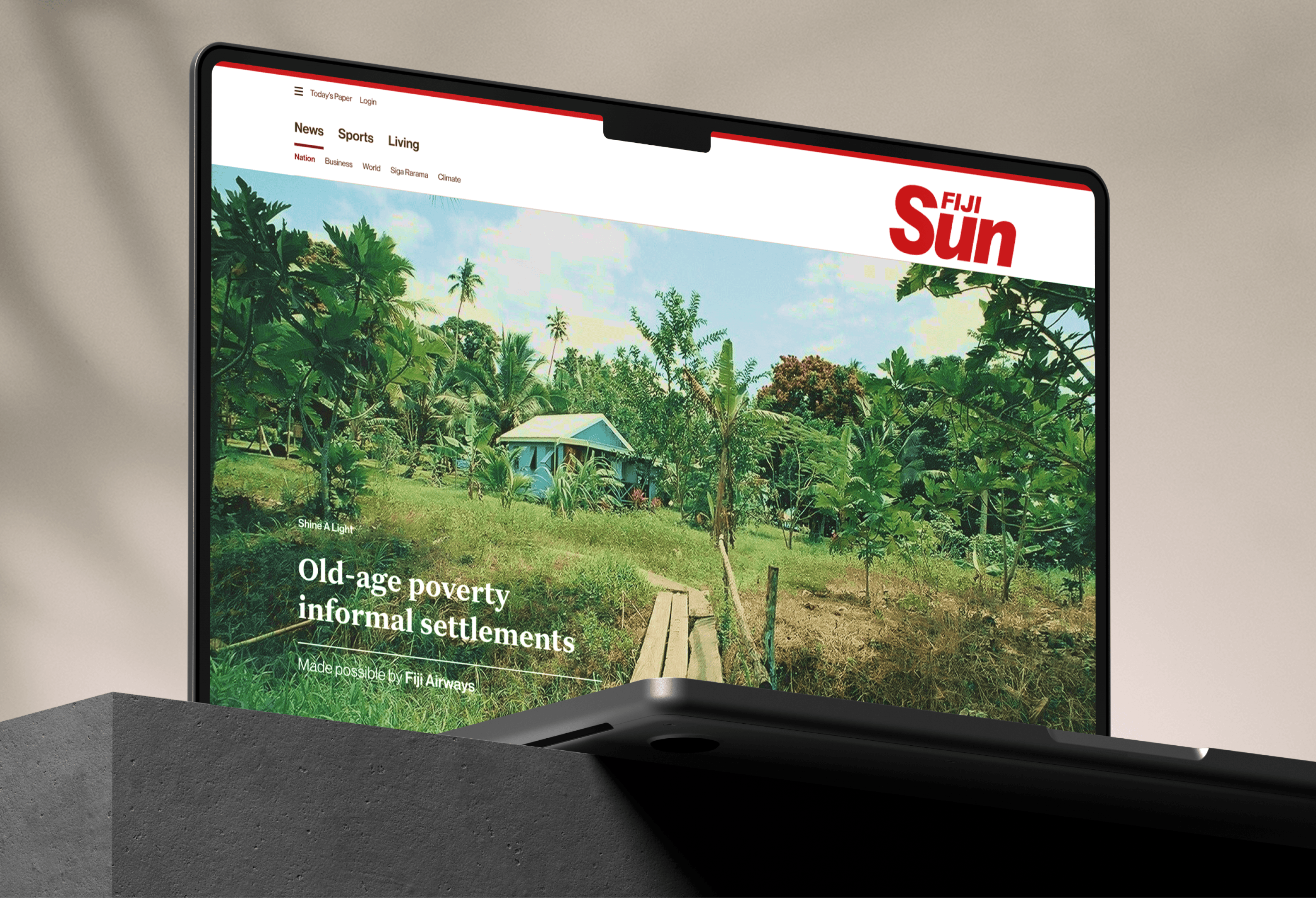 The Fjii Sun homepage on a laptop
